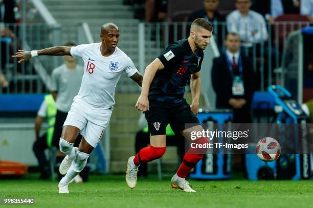 Ashley Young of England and Ante Rebic of Croatia battle for the ball during the 2018 FIFA World Cup Russia Semi Final match between Croatia and...