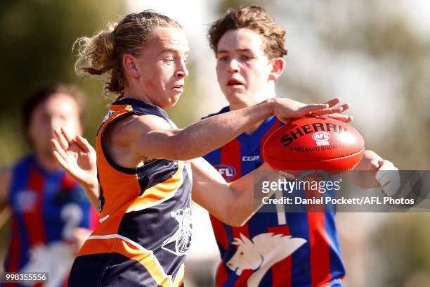 Sam Graham of the Cannons kicks the ball under pressure during the round 12 TAC Cup match between Oakleigh and Calder at Warrawee Park on July 14,...