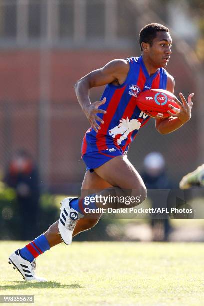 Atunaisa Bosenavualagi of the Chargers runs with the ball during the round 12 TAC Cup match between Oakleigh and Calder at Warrawee Park on July 14,...