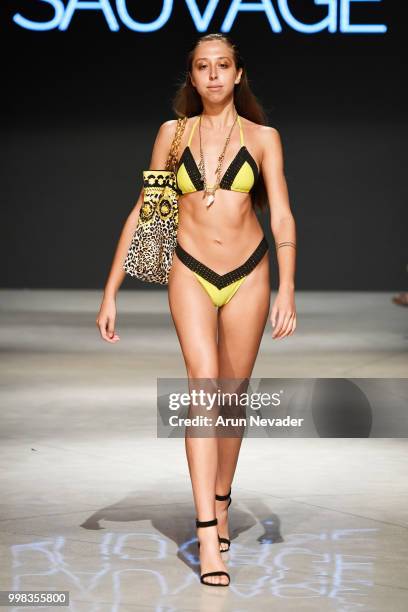 Model walks the runway for Sauvage Swimwear at Miami Swim Week powered by Art Hearts Fashion Swim/Resort 2018/19 at Faena Forum on July 13, 2018 in...