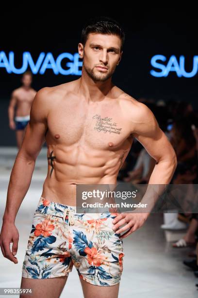 Model walks the runway for Sauvage Swimwear at Miami Swim Week powered by Art Hearts Fashion Swim/Resort 2018/19 at Faena Forum on July 13, 2018 in...