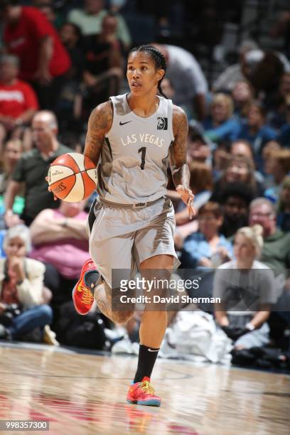 Tamera Young of the Las Vegas Aces handles the ball against the Minnesota Lynx on July 13, 2018 at Target Center in Minneapolis, Minnesota. NOTE TO...