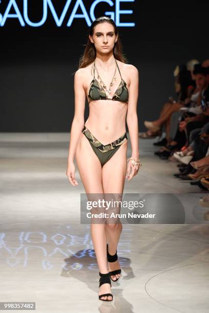 Model walks the runway for Sauvage Swimwear at Miami Swim Week powered by Art Hearts Fashion Swim/Resort 2018/19 at Faena Forum on July 13, 2018 in...