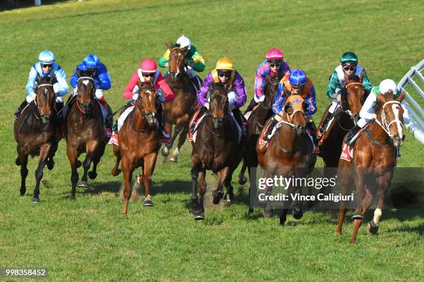 Michael Walker riding Sharpness behind the leader before winning Race 5 during Melbourne Racing at Caulfield Racecourse on July 14, 2018 in...