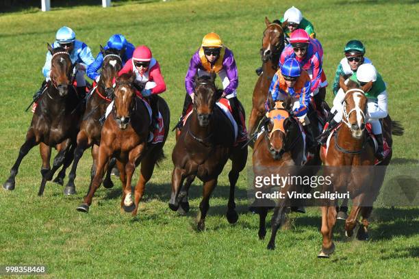 Michael Walker riding Sharpness behind the leader before winning Race 5 during Melbourne Racing at Caulfield Racecourse on July 14, 2018 in...