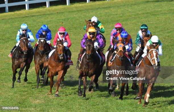 Michael Walker riding Sharpness behind the leader before winning Race 5 during Melbourne Racing at Caulfield Racecourse on July 14, 2018 in...