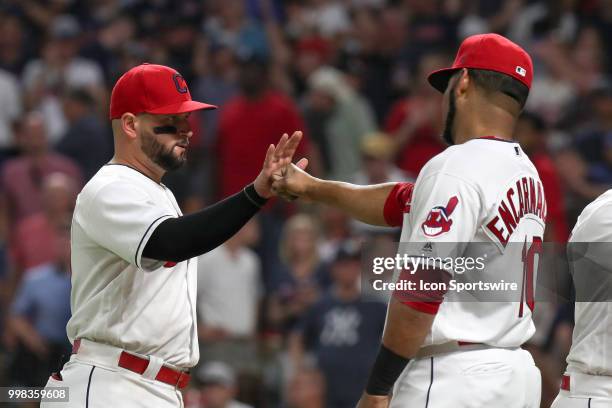 Cleveland Indians first baseman Yonder Alonso and Cleveland Indians designated hitter Edwin Encarnacion celebrate following the Major League Baseball...