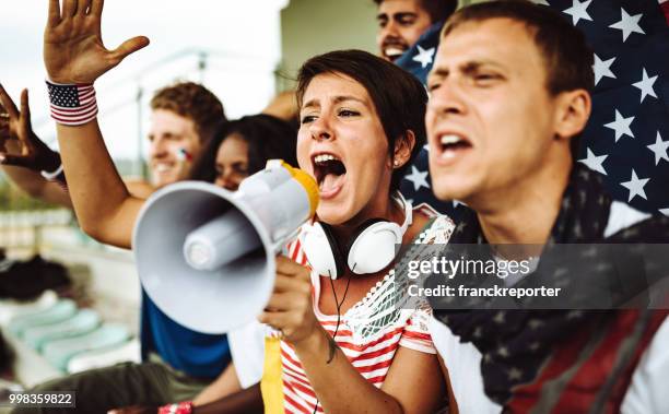 american supporter with flag - franckreporter stock pictures, royalty-free photos & images