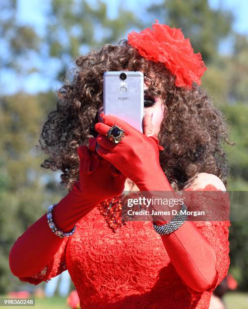 Man dressed as Kate Bush takes a selfie in a park on July 14, 2018 in Sydney, Australia. The Most Wuthering Heights Day is when people all around the...
