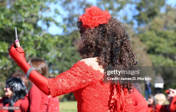 Man dressed as Kate Bush takes a selfie in a park on July 14, 2018 in Sydney, Australia. The Most Wuthering Heights Day is when people all around the...