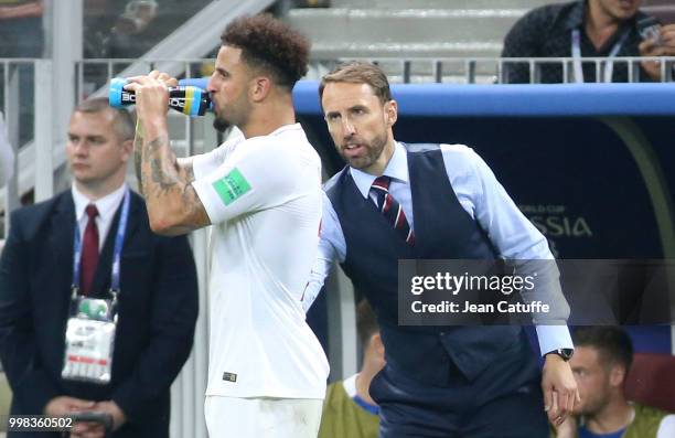 Coach of England Gareth Southgate talks to Kyle Walker during the 2018 FIFA World Cup Russia Semi Final match between England and Croatia at Luzhniki...