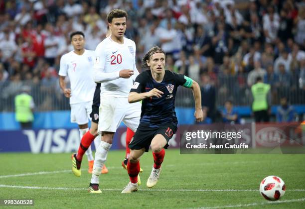 Luka Modric of Croatia. Dele Alli of England during the 2018 FIFA World Cup Russia Semi Final match between England and Croatia at Luzhniki Stadium...