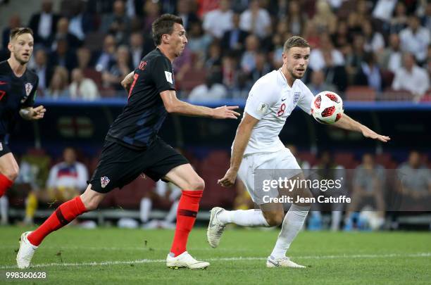 Mario Mandzukic of Croatia, Jordan Henderson of England during the 2018 FIFA World Cup Russia Semi Final match between England and Croatia at...