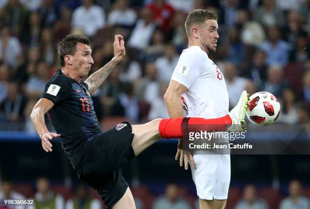 Mario Mandzukic of Croatia, Jordan Henderson of England during the 2018 FIFA World Cup Russia Semi Final match between England and Croatia at...