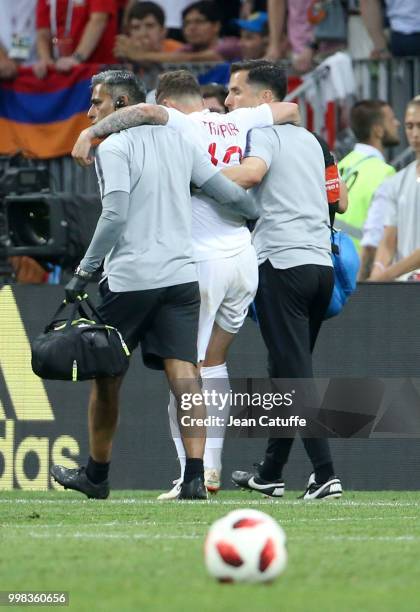 Kieran Trippier of England leaves the pitch with an injury during the 2018 FIFA World Cup Russia Semi Final match between England and Croatia at...