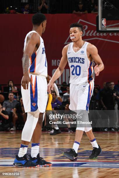 Kevin Knox of the New York Knicks high fives teammates during the game against the Los Angeles Lakers during the 2018 Las Vegas Summer League on July...