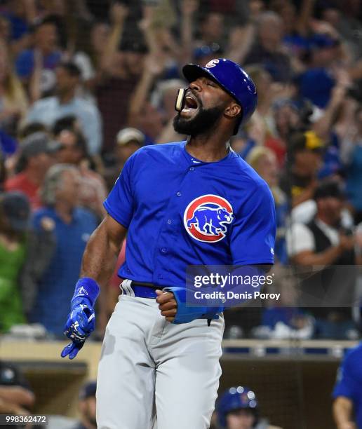 Jason Heyward of the Chicago Cubs celebrates as he scores during the ninth inning of a baseball game against the San Diego Padres at PETCO Park on...