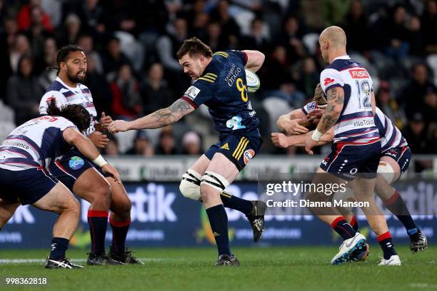 Liam Squire of the Highlanders runs the ball during the round 19 Super Rugby match between the Highlanders and the Rebels at Forsyth Barr Stadium on...