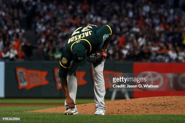 Edwin Jackson of the Oakland Athletics reacts after being called for a balk that scored Steven Duggar of the San Francisco Giants during the fourth...