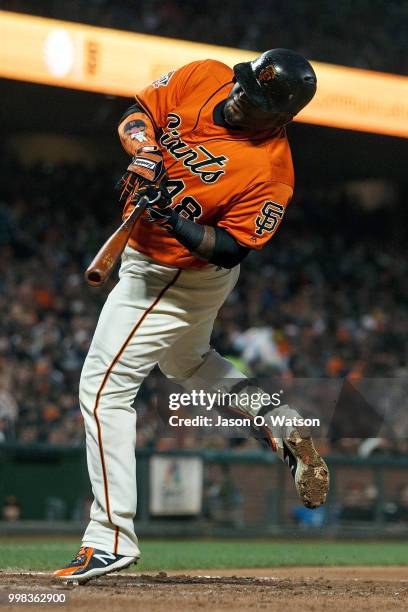 Pablo Sandoval of the San Francisco Giants reacts after getting hit by a pitch from Edwin Jackson of the Oakland Athletics during the fifth inning at...