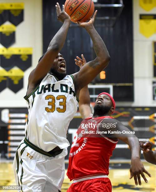 Martez Young of the Fort Hood Wounded Warriors defends Marquis Marshall of the Utah Valor as he goes for a basket in the West Regional of The...