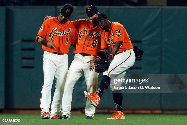 Gorkys Hernandez of the San Francisco Giants, Steven Duggar and Andrew McCutchen celebrate after the game against the Oakland Athletics at AT&T Park...
