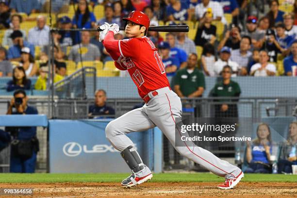 Los Angeles Angels designated hitter Shohei Ohtani doubles to left in the ninth inning during a MLB game between the Los Angeles Angels of Anaheim...