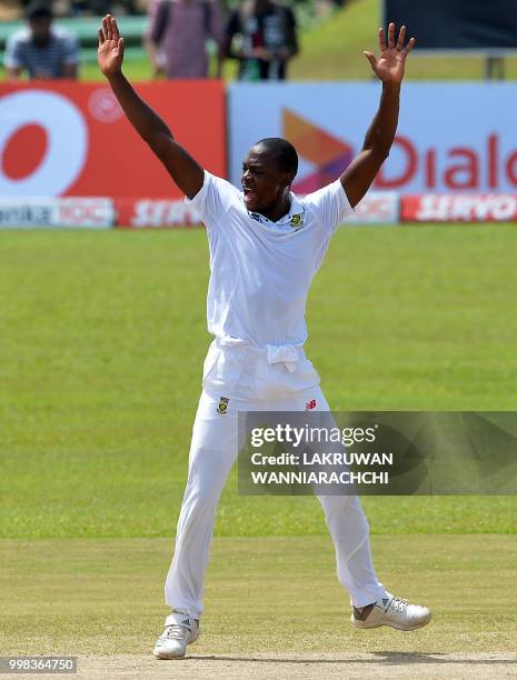 South Africa's Kagiso Rabada celebrates after he dismissed Sri Lanka's Dilruwan Perera during the third day of the opening Test match between Sri...