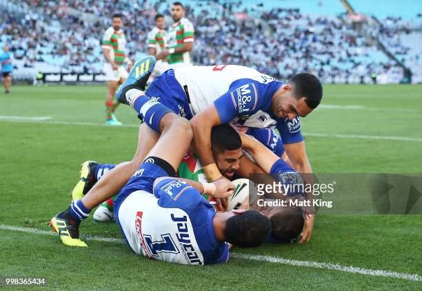 Robert Jennings of the Rabbitohs is tackled just short of the line during the round 18 NRL match between the Canterbury Bulldogs and the South Sydney...