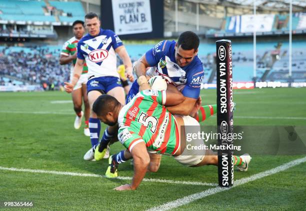 Robert Jennings of the Rabbitohs is tackled in to touch by Reimis Smith of the Bulldogs during the round 18 NRL match between the Canterbury Bulldogs...