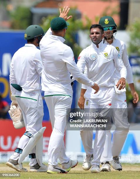 South Africa's Keshav Maharaj celebrates with his teammates after he dismissed Sri Lanka's Angelo Mathews during the third day of the opening Test...