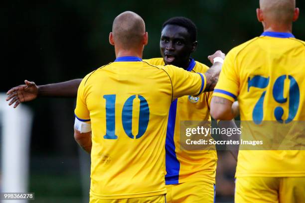 Wesley Sneijder of Al Gharafa celebrates 1-1 with Saeed Alhaj Essa of Al Gharafa during the Club Friendly match between Steaua Bucharest v Al Gharafa...