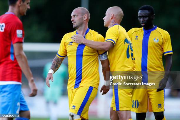 Wesley Sneijder of Al Gharafa celebrates 1-1 with Saeed Alhaj Essa of Al Gharafa, Vladimir Weiss of Al Gharafa during the Club Friendly match between...