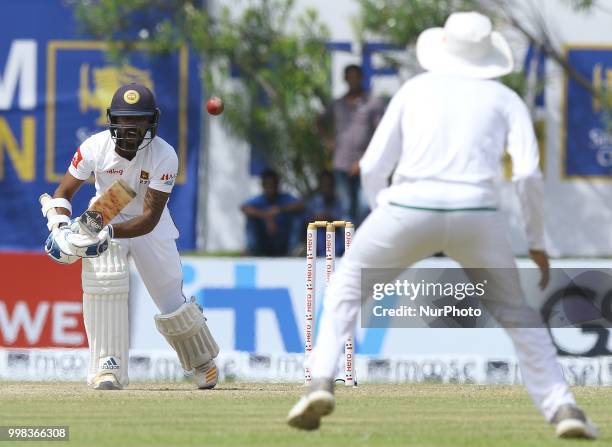 Sri Lankan cricketer Niroshan Dickwella plays a shot during the 3rd day's play in the first Test cricket match between Sri Lanka and South Africa at...