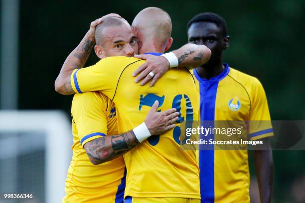 Wesley Sneijder of Al Gharafa celebrates 1-1 with Vladimir Weiss of Al Gharafa, Saeed Alhaj Essa of Al Gharafa during the Club Friendly match between...