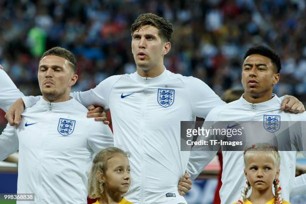 Kieran Trippier of England, John Stones of England and Jesse Lingard of England look on prior to the 2018 FIFA World Cup Russia Semi Final match...