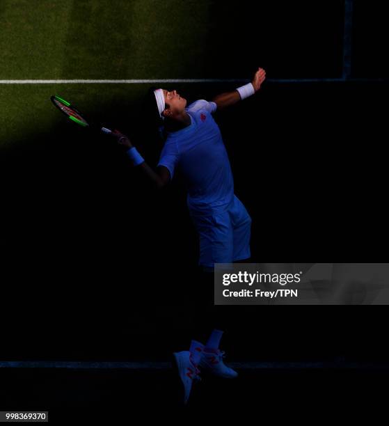 Milos Raonic of Canada in action against John Isner of the United States in the gentlemen's quarter finals at the All England Lawn Tennis and Croquet...