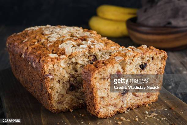sliced banana bread loaf with walnuts and oats - loaf stock pictures, royalty-free photos & images