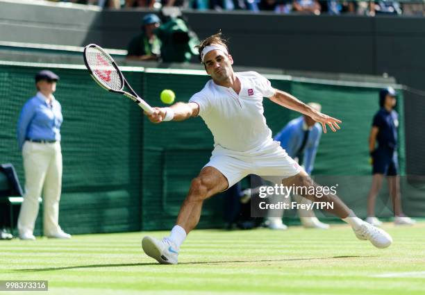 Roger Federer of Switzerland in action against Kevin Anderson of South Africa in the gentlemen's quarter finals at the All England Lawn Tennis and...