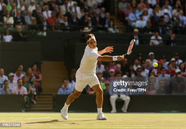 Roger Federer of Switzerland in action against Kevin Anderson of South Africa in the gentlemen's quarter finals at the All England Lawn Tennis and...
