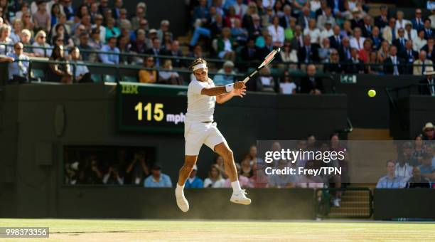 Roger Federer of Switzerland in action against Kevin Anderson of South Africa in the gentlemen's quarter finals at the All England Lawn Tennis and...