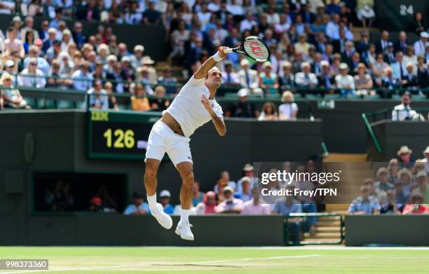 Roger Federer of Switzerland in action against Kevin Anderson of South Africa in the gentlemen's quarter finals at the All England Lawn Tennis and...