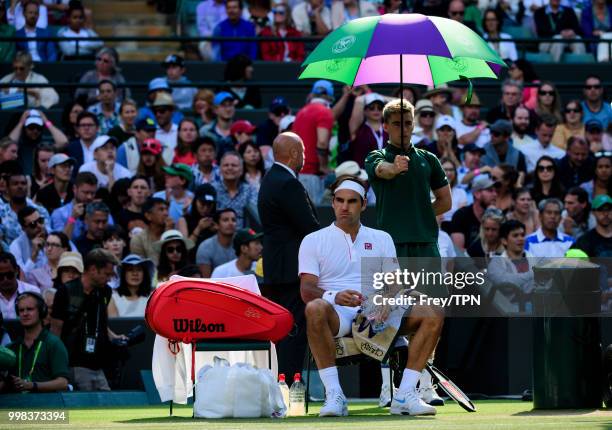 Roger Federer of Switzerland in action against Kevin Anderson of South Africa in the gentlemen's quarter finals at the All England Lawn Tennis and...