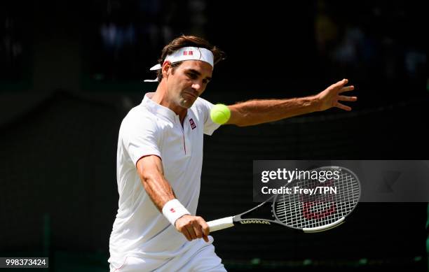 Roger Federer of Switzerland in action against Kevin Anderson of South Africa in the gentlemen's quarter finals at the All England Lawn Tennis and...