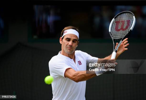 Roger Federer of Switzerland in action against Kevin Anderson of South Africa in the gentlemen's quarter finals at the All England Lawn Tennis and...