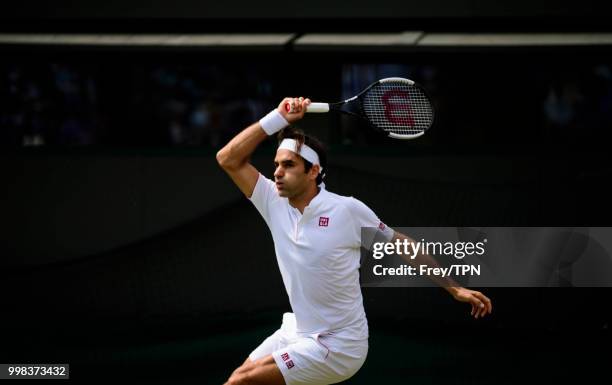 Roger Federer of Switzerland in action against Kevin Anderson of South Africa in the gentlemen's quarter finals at the All England Lawn Tennis and...