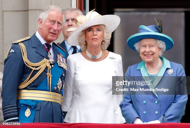 Prince Charles, Prince of Wales, Camilla, Duchess of Cornwall and Queen Elizabeth II watch a flypast to mark the centenary of the Royal Air Force...