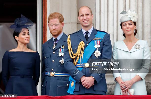 Meghan, Duchess of Sussex, Prince Harry, Duke of Sussex, Prince William, Duke of Cambridge and Catherine, Duchess of Cambridge watch a flypast to...