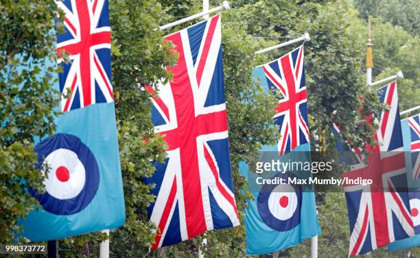 Union flags & RAF flags seen flying along The Mall ahead of a flypast to mark the centenary of the Royal Air Force on July 10, 2018 in London,...