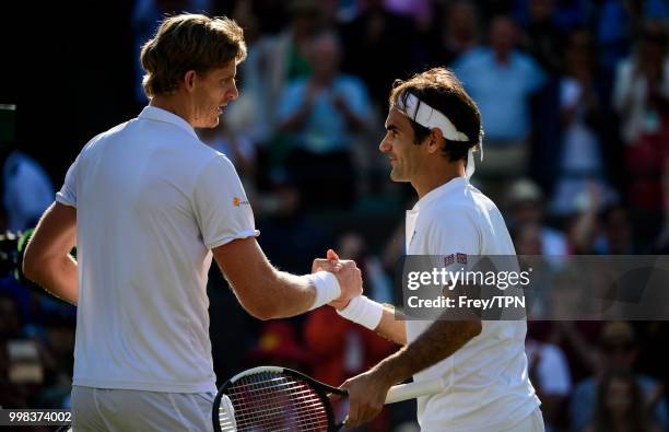 Kevin Anderson of South Africa shakes hands after beating Roger Federer of Switzerland in the gentlemen's quarter finals at the All England Lawn...